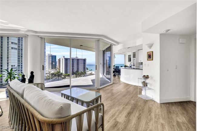 Living room featuring light wood-style flooring, baseboards, and floor to ceiling windows | Image 5
