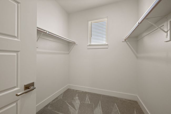 Walk in closet with carpet floors | Image 30