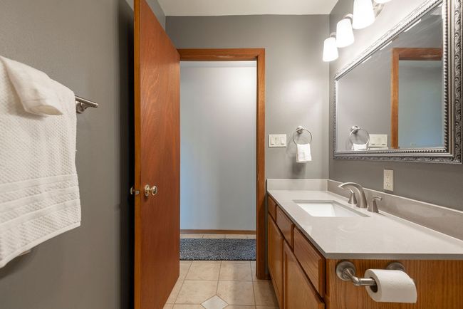 Bathroom featuring vanity and tile patterned flooring | Image 19