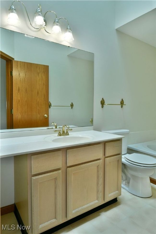 Full bath featuring vanity and a bathtub | Image 42
