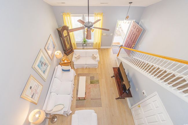 Living room featuring hardwood / wood-style floors and ceiling fan | Image 14
