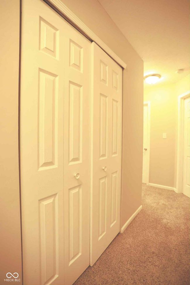 corridor with carpet flooring and baseboards | Image 35