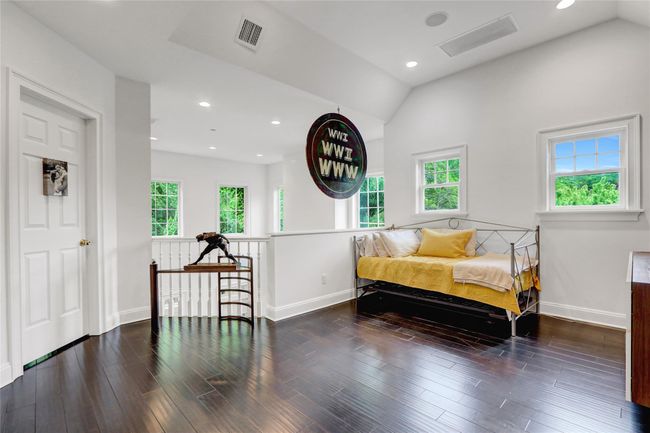 Loft w/ lofted ceiling, wood finished floors, and recessed lighting | Image 22