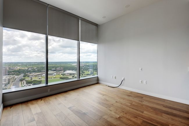 Empty room with wood finished floors and baseboards | Image 8