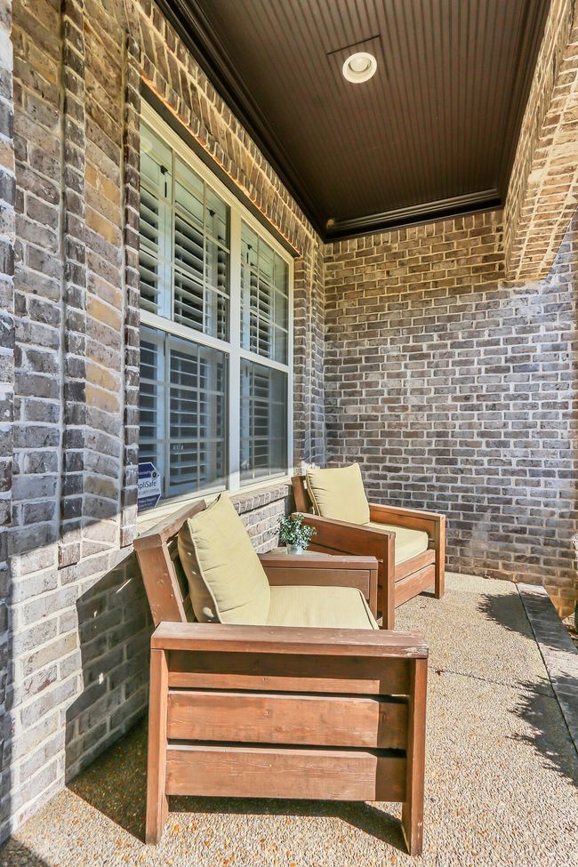 Welcoming front porch - covered and well lit. Enjoy your morning coffee! | Image 5