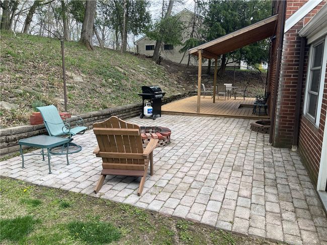 Back patio with pavers and partial roof | Image 7