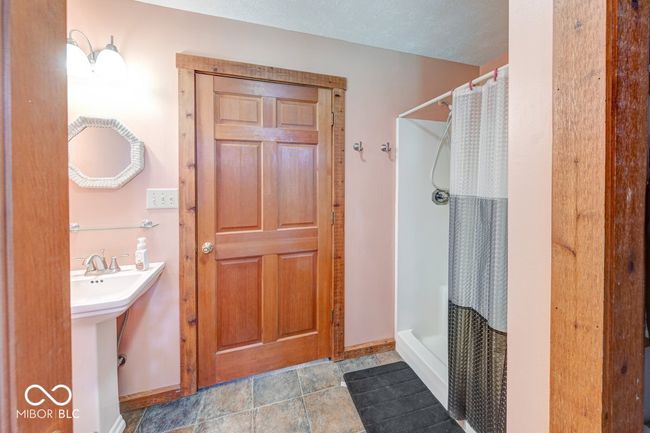 full bath with baseboards and a stall shower | Image 28