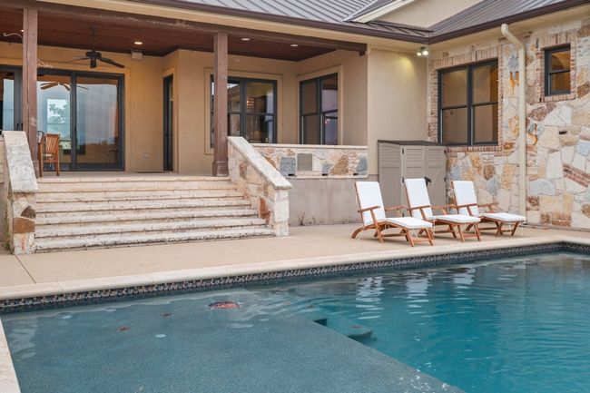 Swimming pool with a patio. | Image 24