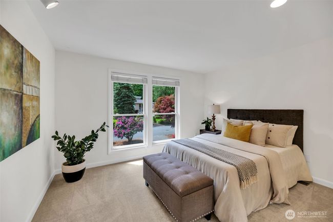 Light filled western facing second bedroom on upper level looks out over the gorgeous front yard | Image 24