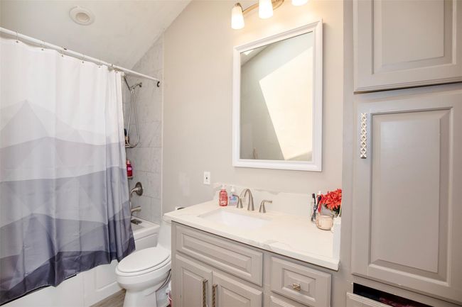 Primary bathroom includes natural light from the skyline above | Image 15