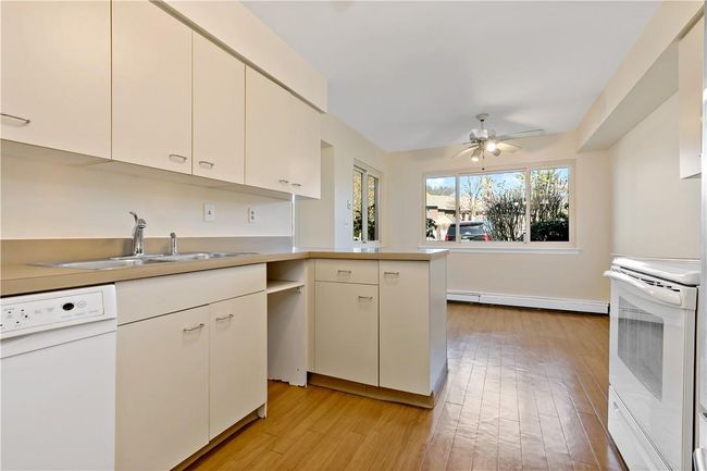Kitchen looking to the informal dining area. | Image 5