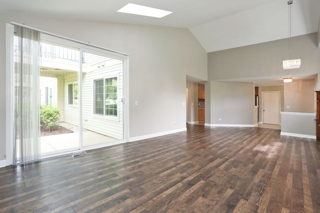 LARGE GLASS SLIDING DOOR OFFERS A PRETTY BACKYARD | Image 7