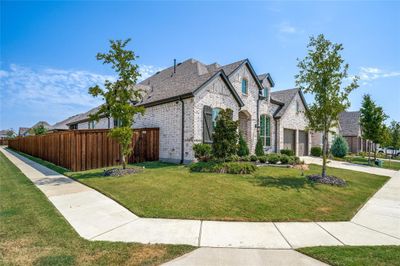 Sitting on a corner lot with beautiful curb appeal. | Image 2