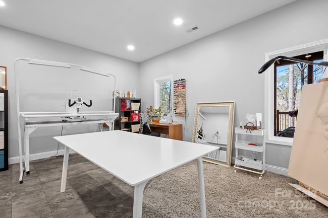 Basement flex room currently used as an art/sewing room. | Image 21