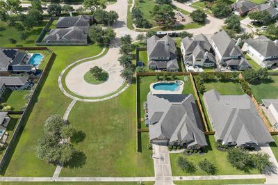 This gorgeous home is perched on a lot with one side of no direct neighbors and a huge greenspace, mature trees and lush landscaping! | Image 2