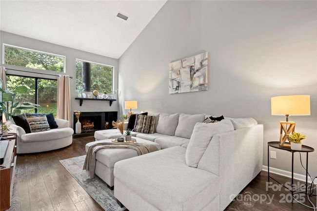 Living room with vaulted ceilings | Image 16