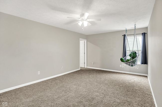 Upstairs - could be a loft but homeowners had it built as a large secondary bedroom. Plenty of room for a roommate, second primary, etc. | Image 27
