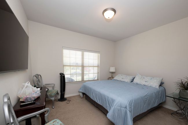 Bedroom with carpet floors and baseboards | Image 22