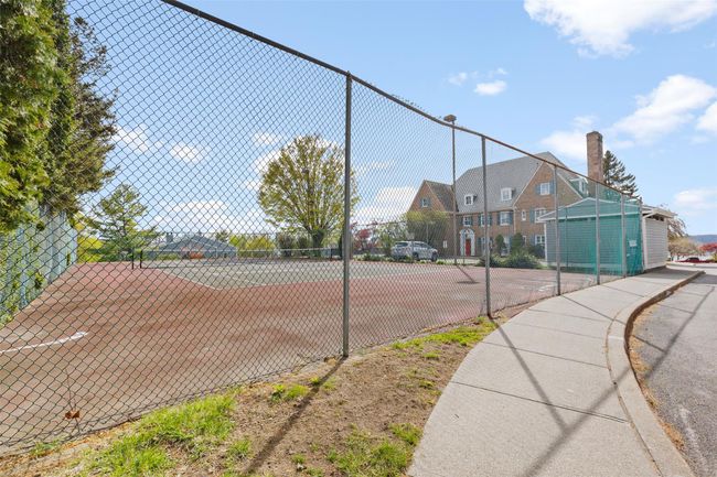 View of tennis court featuring fence | Image 19