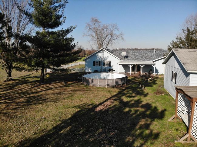 Rear view of house with a lawn | Image 5