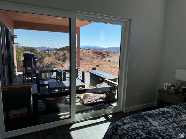Primary bedroom and deck off kitchen and bedroom looking out on arroyo | Image 7