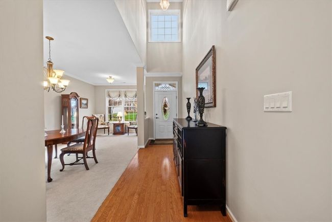 Hardwood floors and a two story entry greet you when you step inside this spacious home with first floor master bedroom. | Image 6