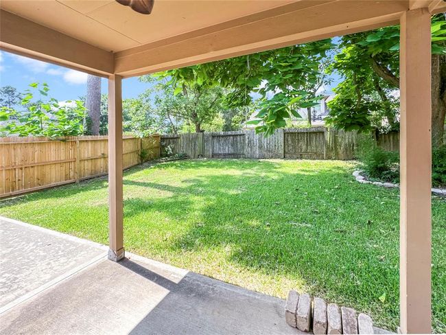 Covered patio to relax and enjoy the peaceful backyard | Image 29