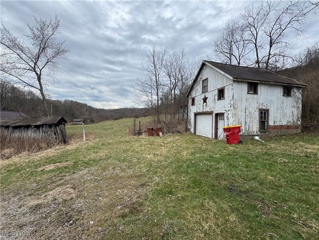 View of yard with driveway and a garage | Image 9