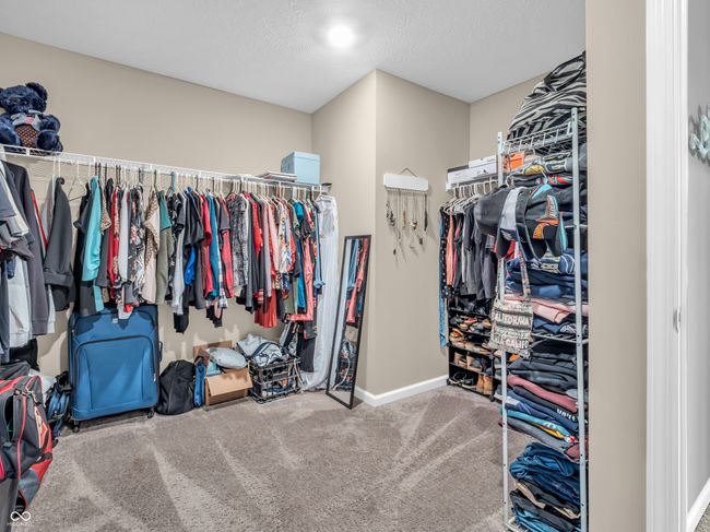 spacious closet with carpet flooring | Image 28