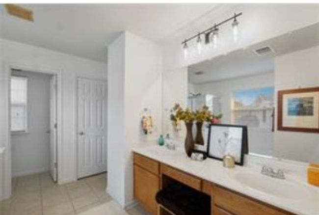 Bathroom with vanity and tile patterned floors | Image 29