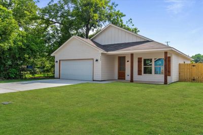 View of front of property featuring a garage and a front lawn | Image 2