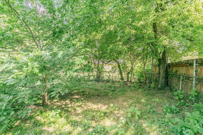 View of fenced backyard | Image 36