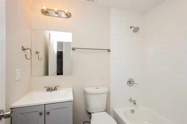 Bathroom with vanity and bathtub / shower combination | Image 22