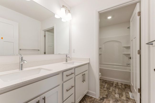 Photo is of the actual home. The secondary bath on the upper level provides the perfect amount of space! | Image 15