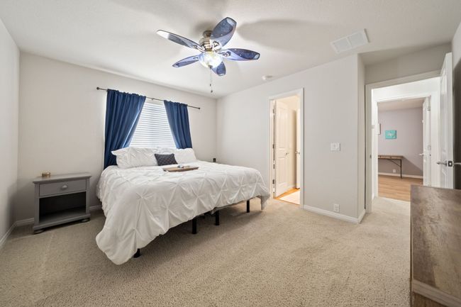 Bedroom with carpet floors and ceiling fan | Image 22