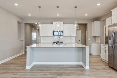 (Photo of a similar home, actual home's finishes will vary slightly) Imagine preparing a wonderful meal in this kitchen or entertaining friends and family over the weekend! | Image 2