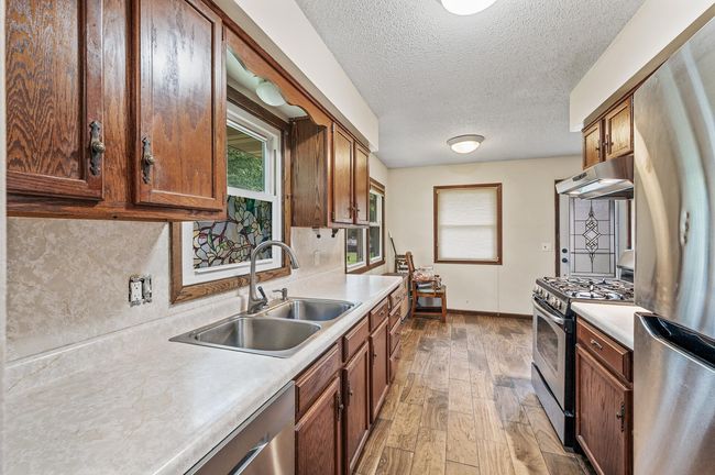 Kitchen has ample cabinet space. | Image 7