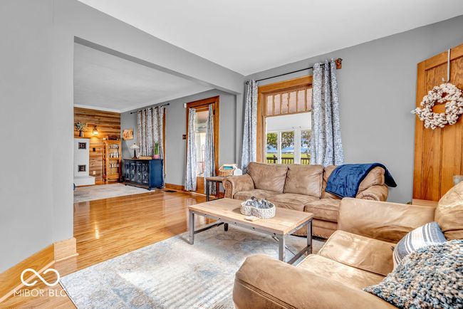 living room with wood finished floors | Image 21