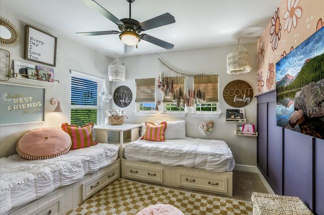 Bedroom with ceiling fan and carpet | Image 26
