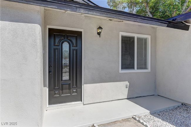 View of exterior entry featuring stucco siding | Image 4
