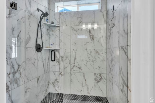 Full bath with a marble finish shower | Image 22