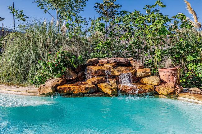 Waterfall feature is a nice addition to your swimming pool gatherings. | Image 40