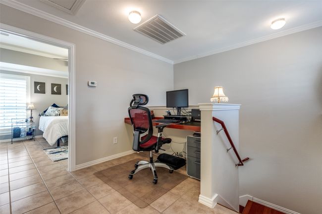 Built-in desk in upstairs nook with matching chair | Image 15
