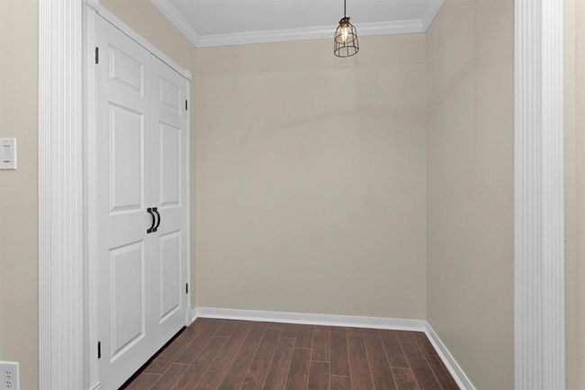 Originally the closet for this room, it was expanded into the closet space for what was once the 4th bedroom (now office) This adds extra space, utility and closet room to this bedroom. It could be returned to it's original configuration if desired by new owners. | Image 25