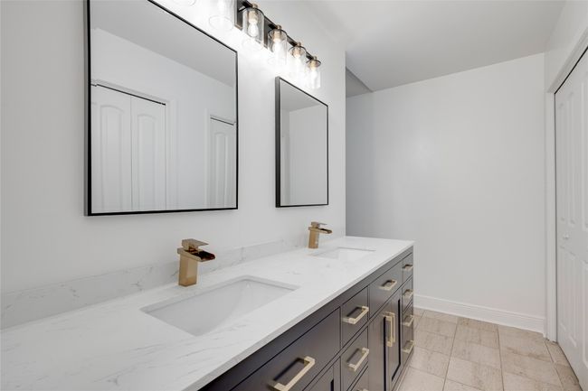 Bathroom with a sink, double vanity, and baseboards | Image 26