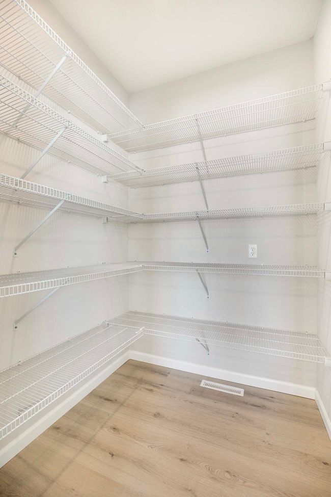 Spacious walk-in pantry located off kitchen. | Image 6