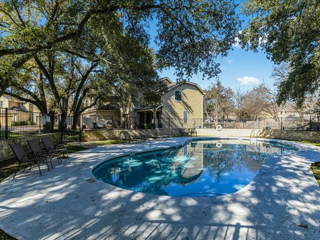 View of pool with a fenced in pool, fence, and a patio area | Image 30