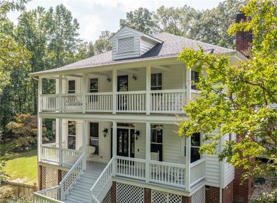 Stunning "Carolina" styled home with full front balconies. | Image 1