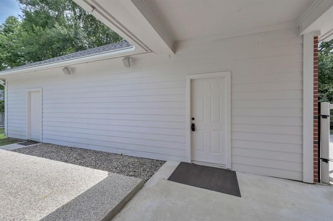 Main House back patio. Garage door entrance. | Image 33