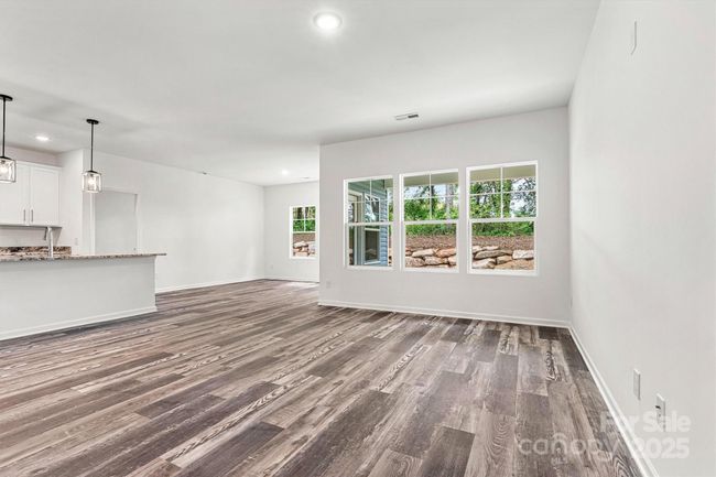 View of open great/dining/kitchen areas | Image 21